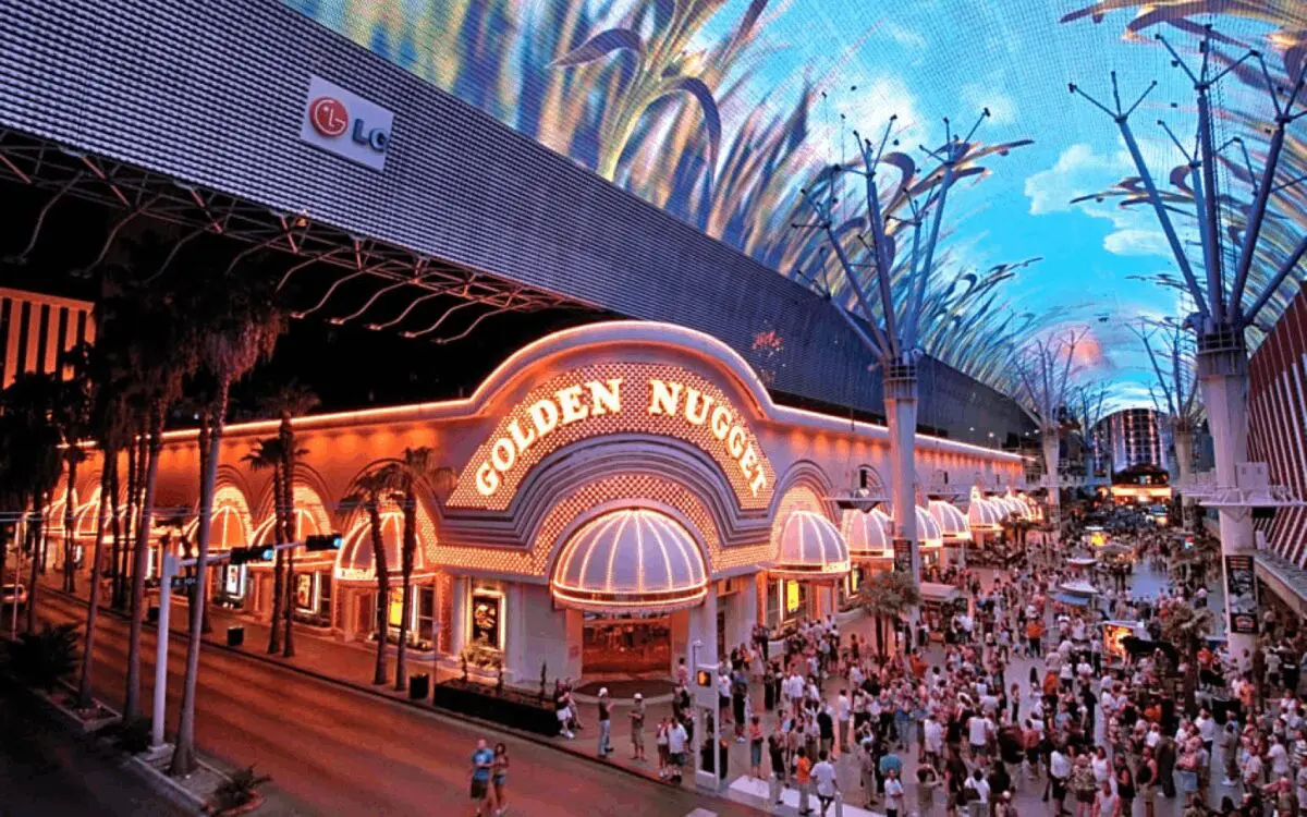 Golden Nugget casino with crowd outside, evening.