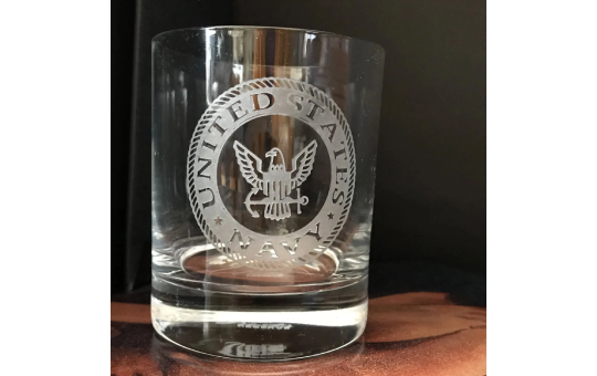 Glass with United States Navy emblem engraving.